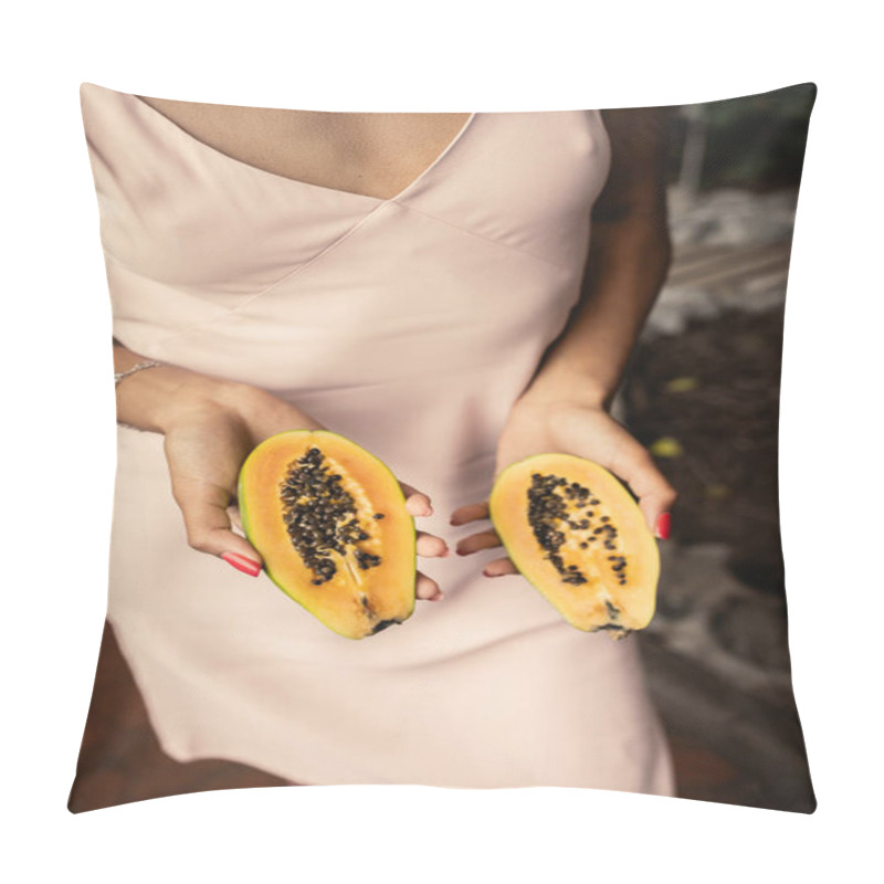 Personality  Cropped view of young african american woman in summer dress holding cut and fresh papaya and standing in blurred garden center, fashion-forward lady inspired by tropical plants, summer concept pillow covers