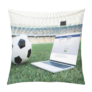 Personality  KYIV, UKRAINE - JUNE 20, 2019: Soccer Ball And Laptop With Facebook Website On Grassy Football Pitch At Stadium Pillow Covers