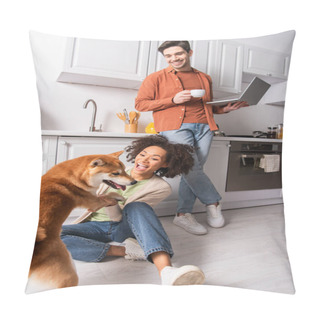 Personality  African American Woman Playing With Shiba Inu Near Boyfriend With Laptop And Coffee In Kitchen  Pillow Covers
