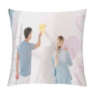 Personality  Man Painting White Wall In Yellow While Girlfriend Drawing Pink Heart Pillow Covers