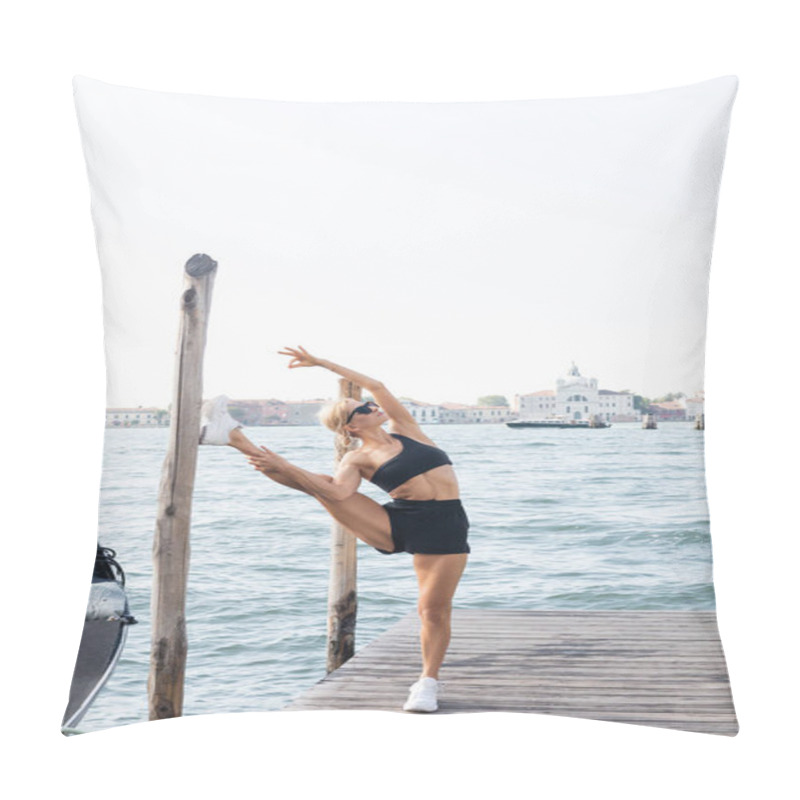 Personality  Fit Sportswoman In Sunglasses, White Sneakers, Black Crop Top And Shorts Stretching On Pier In Venice  Pillow Covers