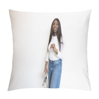 Personality  This Vibrant Image Captures A Smiling Young Black Woman Dressed In A Casual, Stylish Manner, Standing Against A Plain White Background. She Wears A Classic White Top And Blue Jeans, Accessorized With Pillow Covers