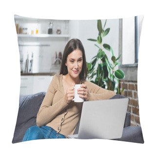 Personality  Joyful Freelancer Looking At Laptop While Sitting On Sofa In Kitchen With Cup Of Warming Drink Pillow Covers