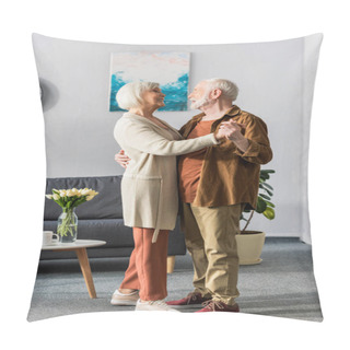 Personality  Happy Senior Couple Dancing While Looking At Each Other Near Table With Tulips Pillow Covers