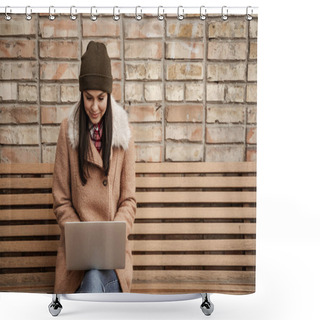 Personality  Happy Brunette Freelancer In Beanie Hat Using Laptop While Sitting On Bench Shower Curtains