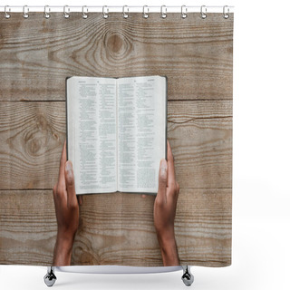 Personality  Cropped Shot Of Man Holding Holy Bible Over Wooden Table Shower Curtains