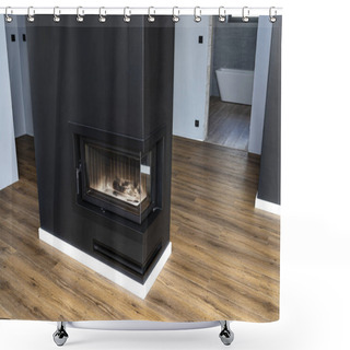 Personality  A Modern Fireplace With A Closed Combustion Chamber Standing In The Living Room, Painted Black, With A Washed Corner Pane. Shower Curtains
