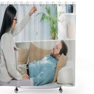 Personality  Side View Of Young Hypnotist With Pendulum And Bearded Man With Closed Eyes Lying In Couch During Hypnotherapy Shower Curtains