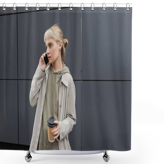 Personality  Stylish Young Woman With Bangs And Blonde Hair Holding Paper Cup With Coffee To Go While Talking On Smartphone And Standing In Hoodie And Coat Near Grey Modern Building On Urban Street  Shower Curtains