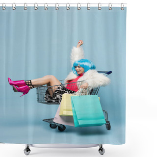 Personality  Cheerful Asian Pop Art Woman Holding Shopping Bags While Sitting In Cart On Blue Background  Shower Curtains