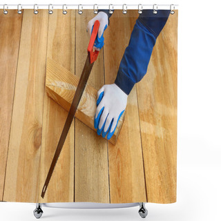 Personality  Male Working Hands In Gloves Sawing A Wooden Board Against The Background Of A Wooden Floor. Construction And Design Of The House. Shower Curtains