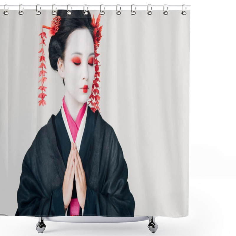Personality  beautiful geisha in black kimono with red flowers in hair and greeting hands isolated on white shower curtains