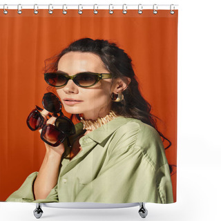 Personality  A Stylish Woman Exudes Summertime Vibes Wearing A Green Shirt And Fashionable Sunglasses Against An Orange Background. Shower Curtains