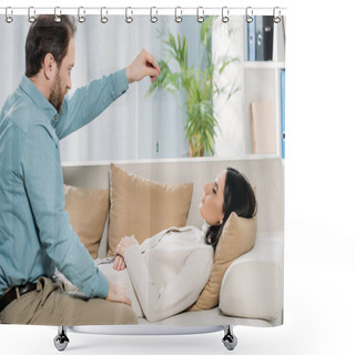 Personality  Side View Of Bearded Hypnotist Holding Pendulum And Hypnotising Young Woman With Closed Eyes Lying On Couch Shower Curtains