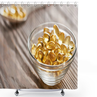 Personality  Selective Focus Of Golden Fish Oil Capsules In Glass Bowl And Spoon On Wooden Table Shower Curtains