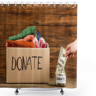 Personality  Cropped View Of Man Putting Money In Jar Near Cardboard Box With Donate Lettering And Clothes On Wooden Background, Charity Concept Shower Curtains