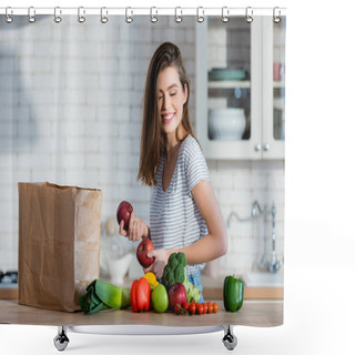 Personality  Positive Woman Holding Juicy Apples Near Paper Bag And Vegetables On Kitchen Table Shower Curtains