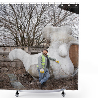 Personality  Indian Worker In Safety Vest And Gloves Looking Away While Standing Near Concrete Sculpture In Outdoor Waste Disposal Station, Garbage Sorting And Recycling Concept Shower Curtains