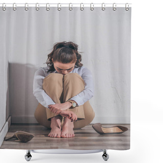 Personality  Sad Woman In White Blouse And Beige Pants Sitting On Floor, Hugging Knees Near Wall At Home, Grieving Disorder Concept Shower Curtains