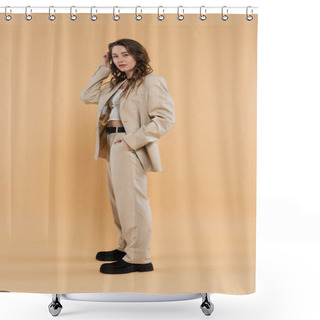 Personality  Style And Fashion Concept, Young Woman With Wavy Hair Standing In Fashionable Suit And Looking At Camera While Posing On Beige Background, Hand In Pocket, Modern Elegance Shower Curtains