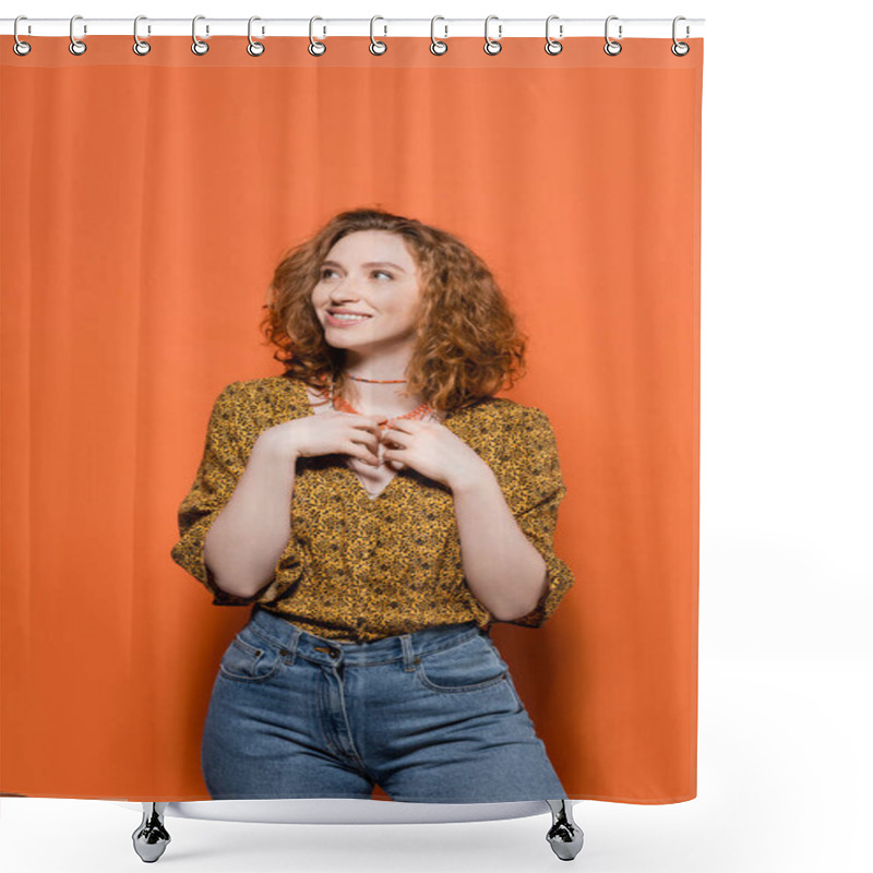 Personality  Positive red haired model in casual blouse and jeans touching necklaces and looking away while standing on orange background, stylish casual outfit and summer vibes concept, Youth Culture shower curtains