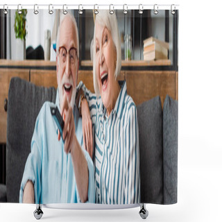 Personality  Panoramic Shot Of Senior Couple Laughing While Watching Tv On Sofa At Home Shower Curtains