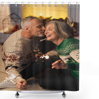 Personality  Positive Middle Aged Man Kissing Wife And Holding Shiny Sparklers On Christmas Eve  Shower Curtains