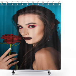 Personality  Young Brunette Woman With Dark Makeup Looking At Camera Near Red Rose On Blue Shower Curtains