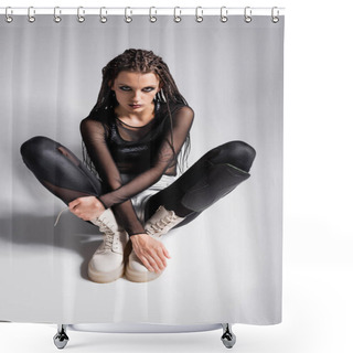 Personality  Futuristic Woman In White Boots And Black Tight Jumpsuit Sitting And Looking At Camera On Grey Background Shower Curtains