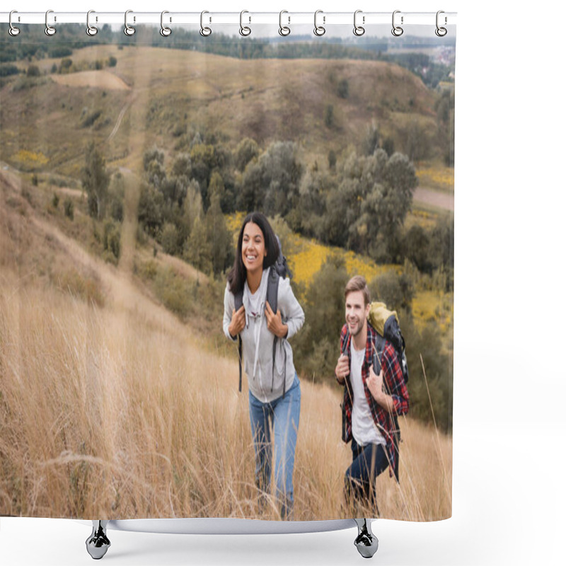 Personality  Interracial Couple With Backpacks Walking On Hill With Grass During Trip  Shower Curtains