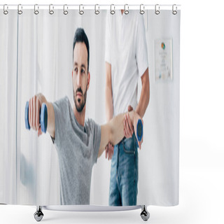Personality  Panoramic Shot Of Chiropractor Stretching Arm Of Handsome Patient With Dumbbells In Hospital Shower Curtains