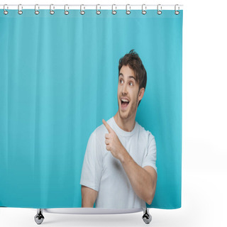 Personality  Surprised Guy Looking Away And Pointing With Finger On Blue Background Shower Curtains