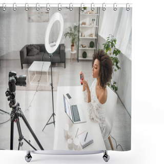 Personality  KYIV, UKRAINE - DECEMBER 10, 2019: African American Influencer Holding Hair Straightener Near Digital Camera And Laptop With Facebook Website  Shower Curtains