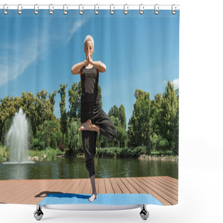 Personality  Woman Practicing Yoga In Tree Pose (Vrksasana) On Yoga Mat Near River In Park Shower Curtains