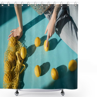 Personality  Cropped View Of Tattooed Woman In Shiny Top With Sequins And Jeans Sitting Near String Bag With Ripe Lemons On Blue  Shower Curtains