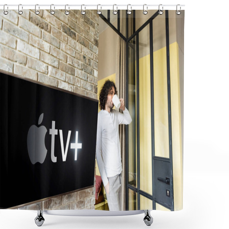 Personality  KYIV, UKRAINE - APRIL 25, 2020: Young Man In Pajamas Drinking Coffee While Standing Near Green Lcd Screen With Apple TV Shower Curtains