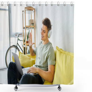 Personality  Smiling Young Guy With Headphones And Laptop In Yellow Couch Saying Hello To Online Meeting Sideways Shower Curtains