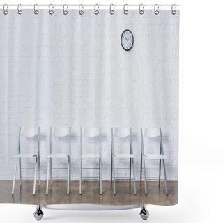 Personality  Row Of Empty Chairs By White Brick Wall With Clock Shower Curtains