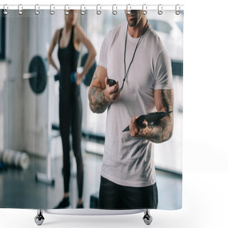 Personality  Cropped Shot Of Male Personal Trainer Looking At Timer And Young Sportswoman Exercising With Dumbbells Behind At Gym Shower Curtains