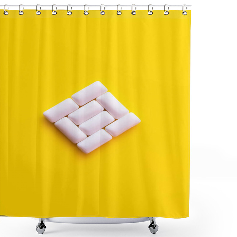 Personality  Flat lay of chewing gums in square shape on yellow background  shower curtains
