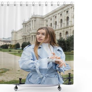 Personality  Young Woman In Blue Trench Coat Checking Time On Wristwatch While Waiting Near Historical Building In Vienna  Shower Curtains