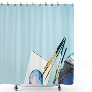 Personality  Top View Of Paintbrushes On Watercolor Painting And Color Samples On Blue Background Shower Curtains