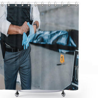Personality  Cropped Image Of Policeman With Gun In Holster Putting On Latex Gloves At Crime Scene With Corpse In Body Bag  Shower Curtains