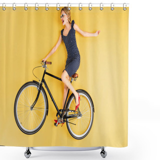 Personality  Joyful Woman In Sunglasses And Dress Riding On Bicycle On Yellow Background Shower Curtains