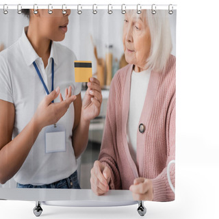 Personality  Multiracial Social Worker Holding Credit Card Near Senior Woman At Home  Shower Curtains