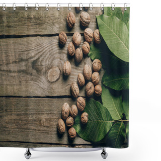 Personality  Top View Of Whole Natural Walnuts And Green Leaves On Wooden Table Shower Curtains