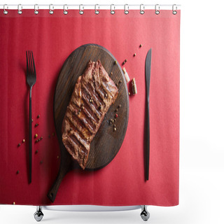 Personality  Top View Of Tasty Grilled Steak Served On Wooden Board On Red Background With Pepper And Cutlery Shower Curtains