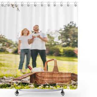Personality  Close-up View Of Picnic Basket And Couple Playing With Drone Behind In Park Shower Curtains