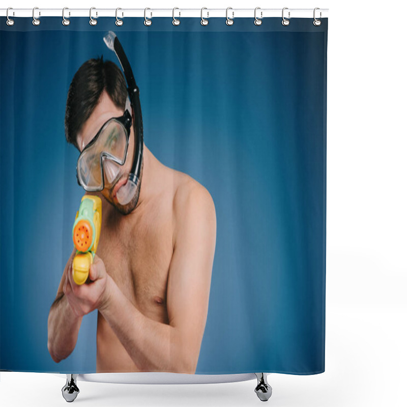 Personality  young man in snorkel and diving mask holding water gun on blue  shower curtains