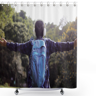 Personality  Young Asian Man In A Casual Outfit, Sporting A Beanie, Plaid Shirt, Backpack, And Headphones, Stretches His Arms Wide With A Smile, Seemingly Enjoying The Fresh Morning Air On A Nature Walk. Shower Curtains
